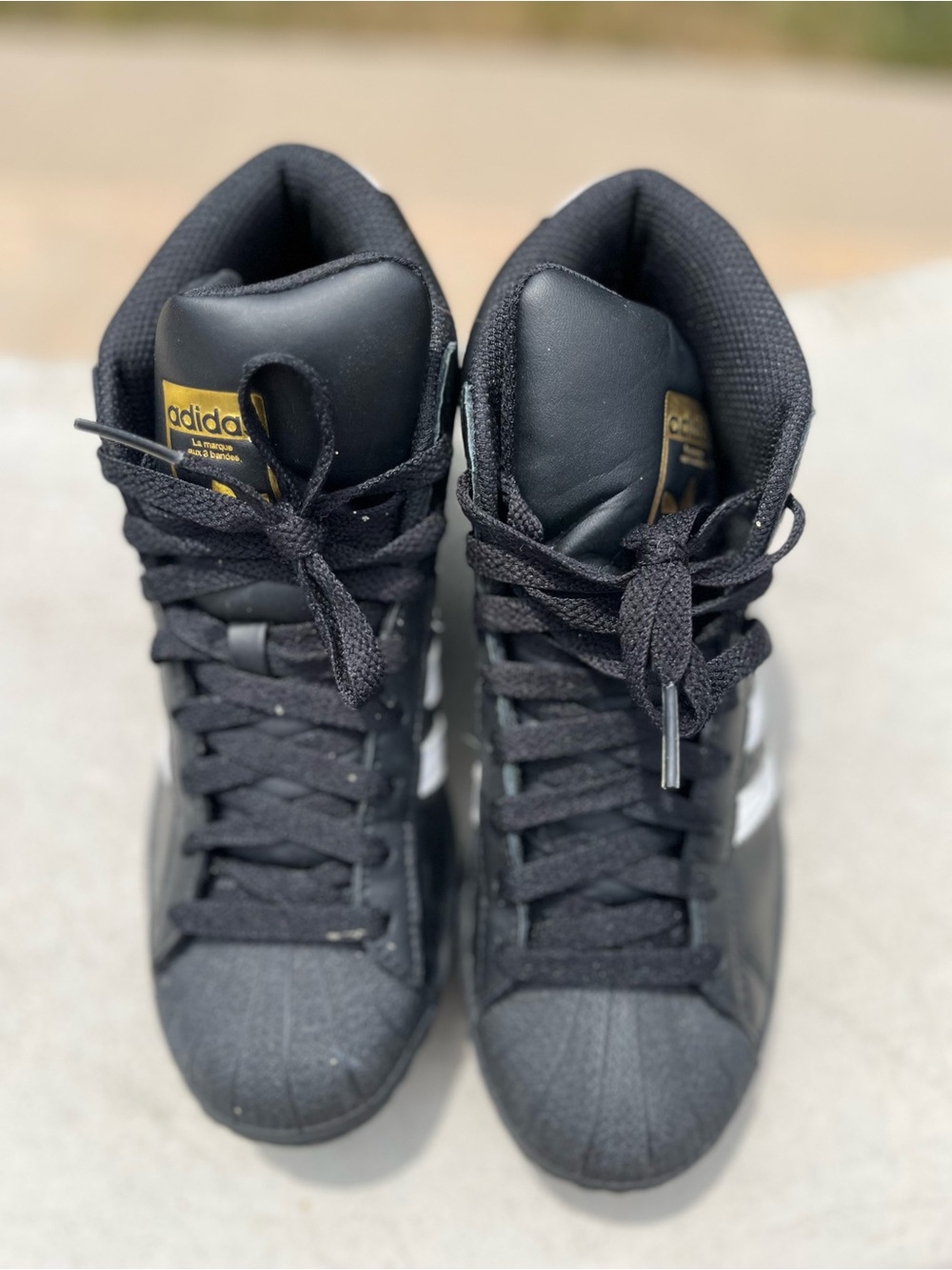 Adidas pro-model high top sneakers.